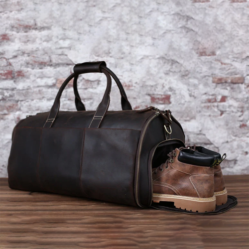 Full-grain brown leather garment duffel bag with carry handles